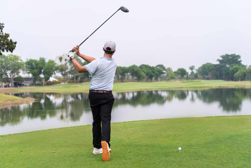 Photo of man golfing